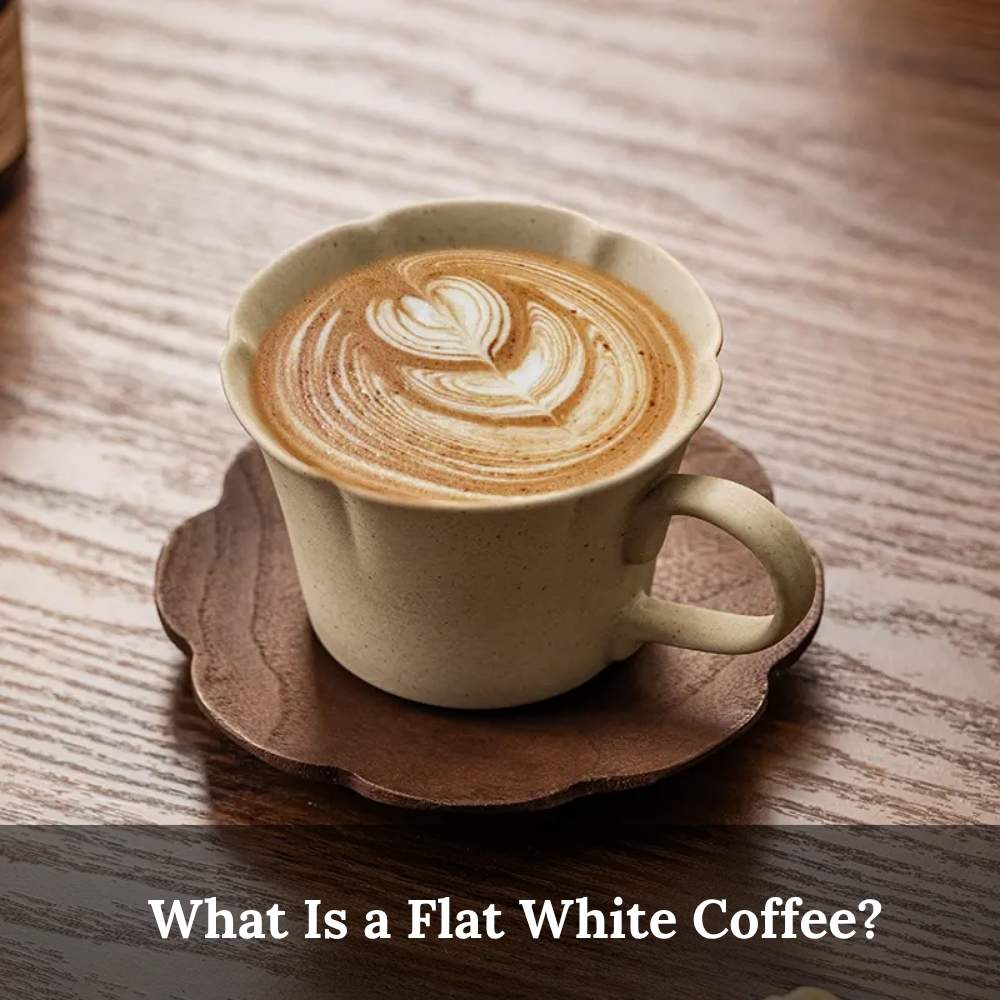 a Flat white coffee in ceramic cup with smooth microfoam and heart-shaped latte art on wooden table